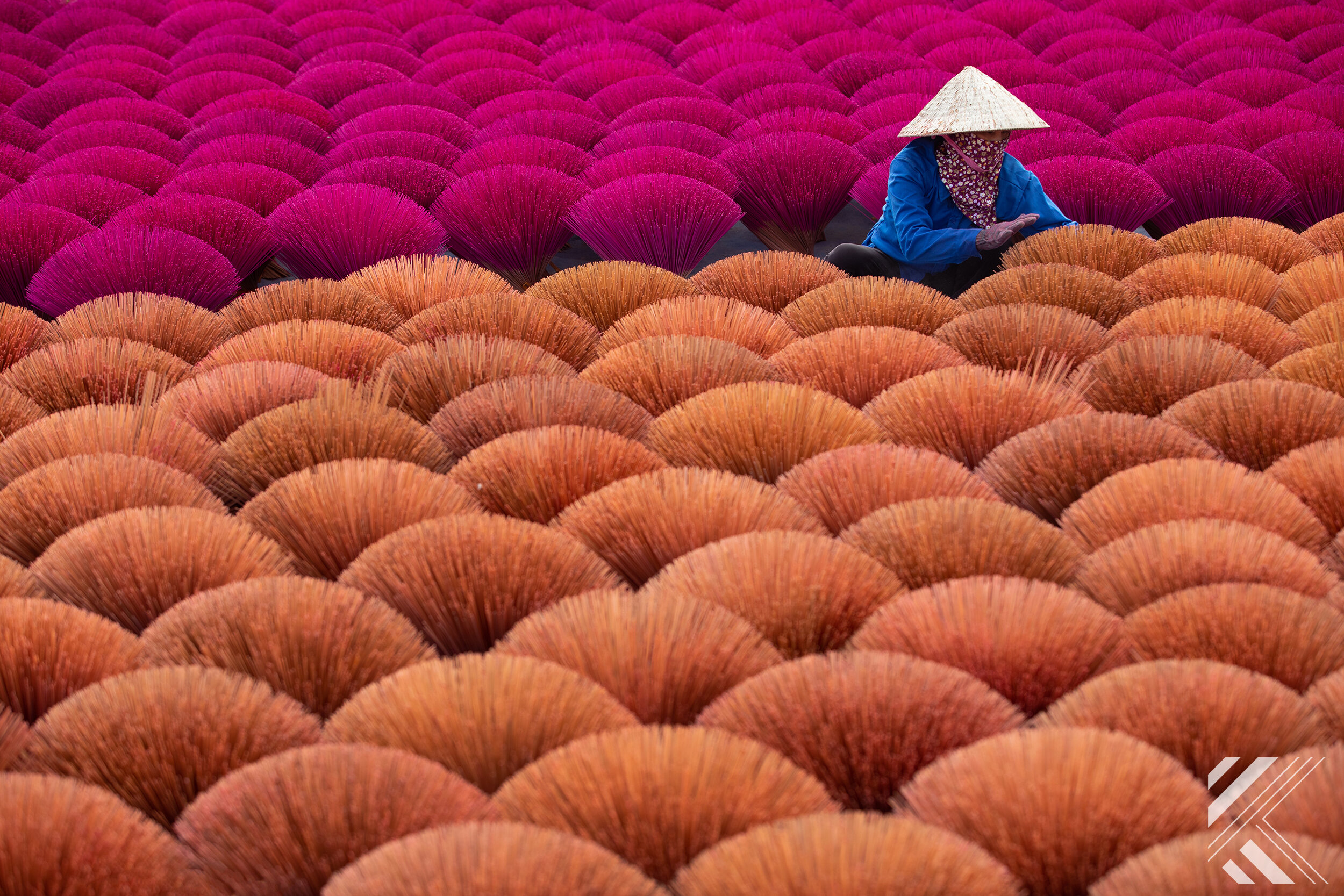 Woman tending insense in Quang Phu Cau, Vietnam 