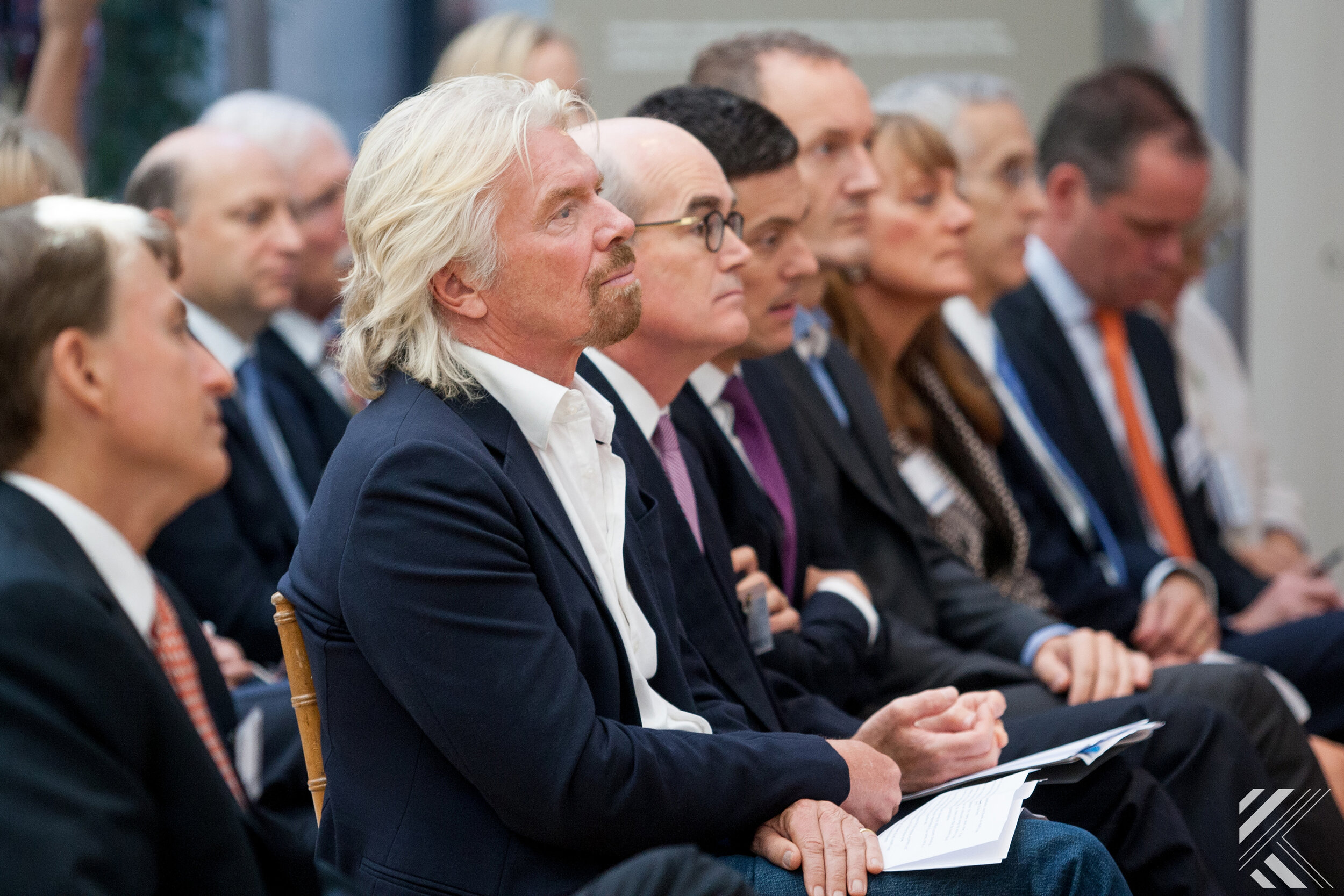 Richard Branson listening to speaking program