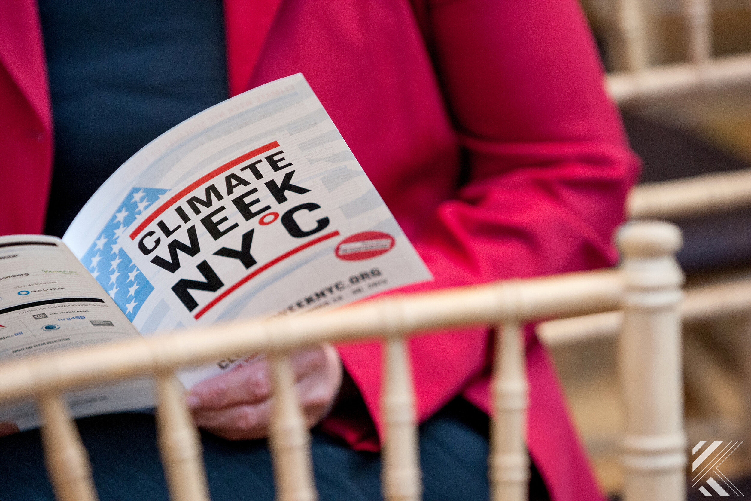 Conference attendee looking at program