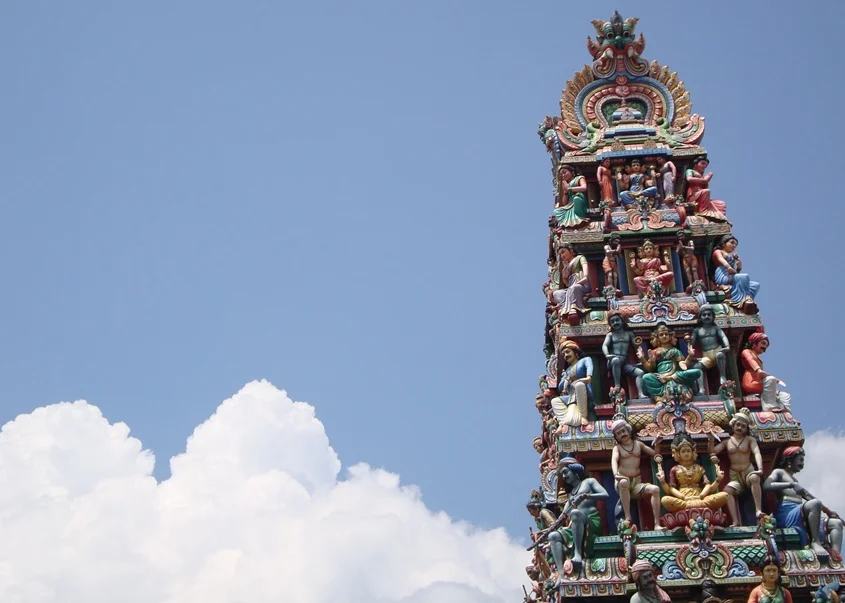 The gopuram (pagoda) of the Sri Mariamman temple, showing some of the fine detail on the sculptures. Photograph © Oogachaga