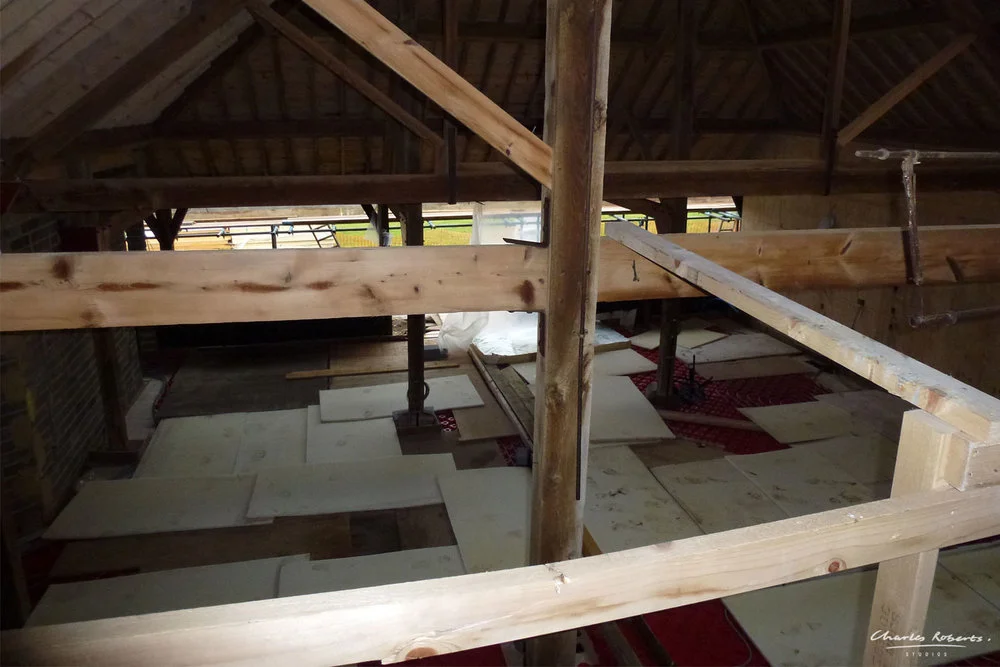 Photograph looking down into the proposed kitchen