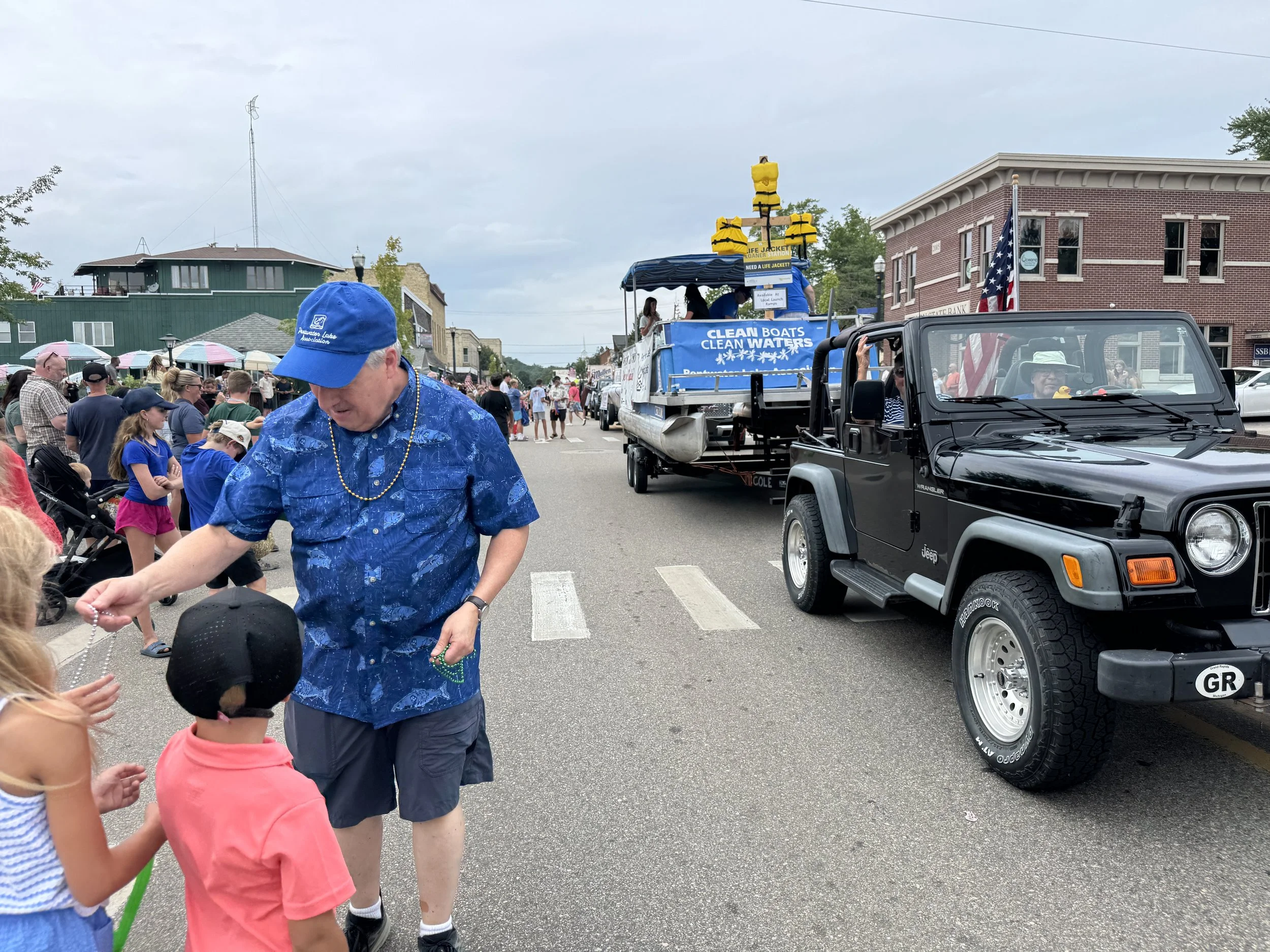2026 Ross handing out beads.JPG
