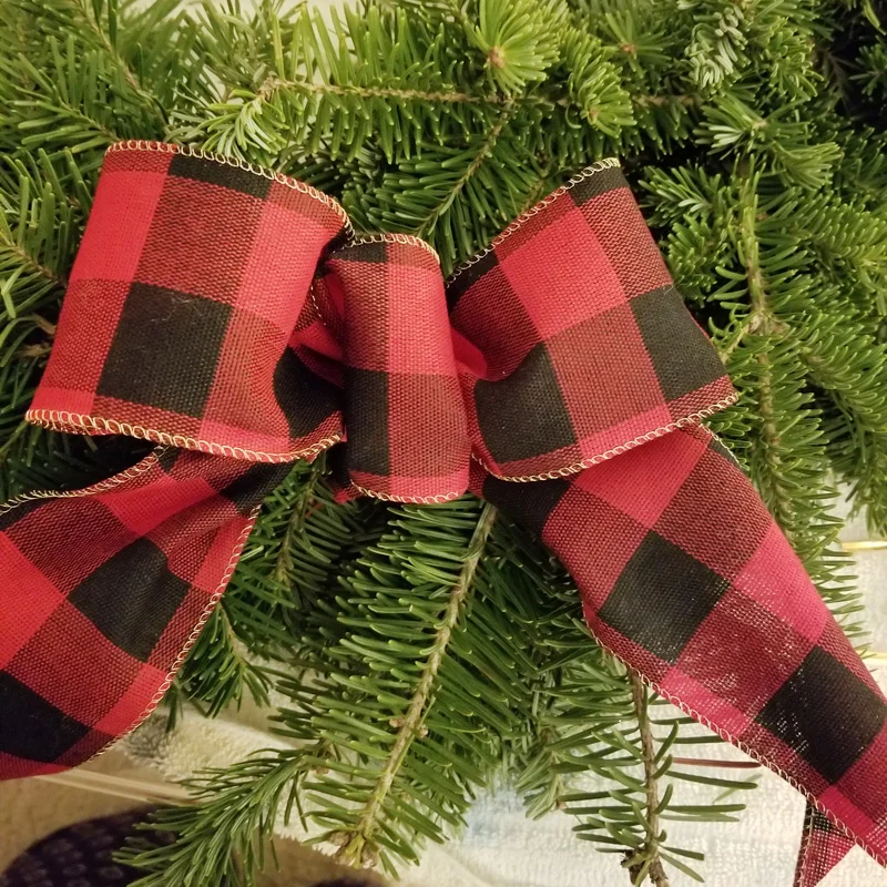 attaching a wire ribbon bow to a wreath.jpg