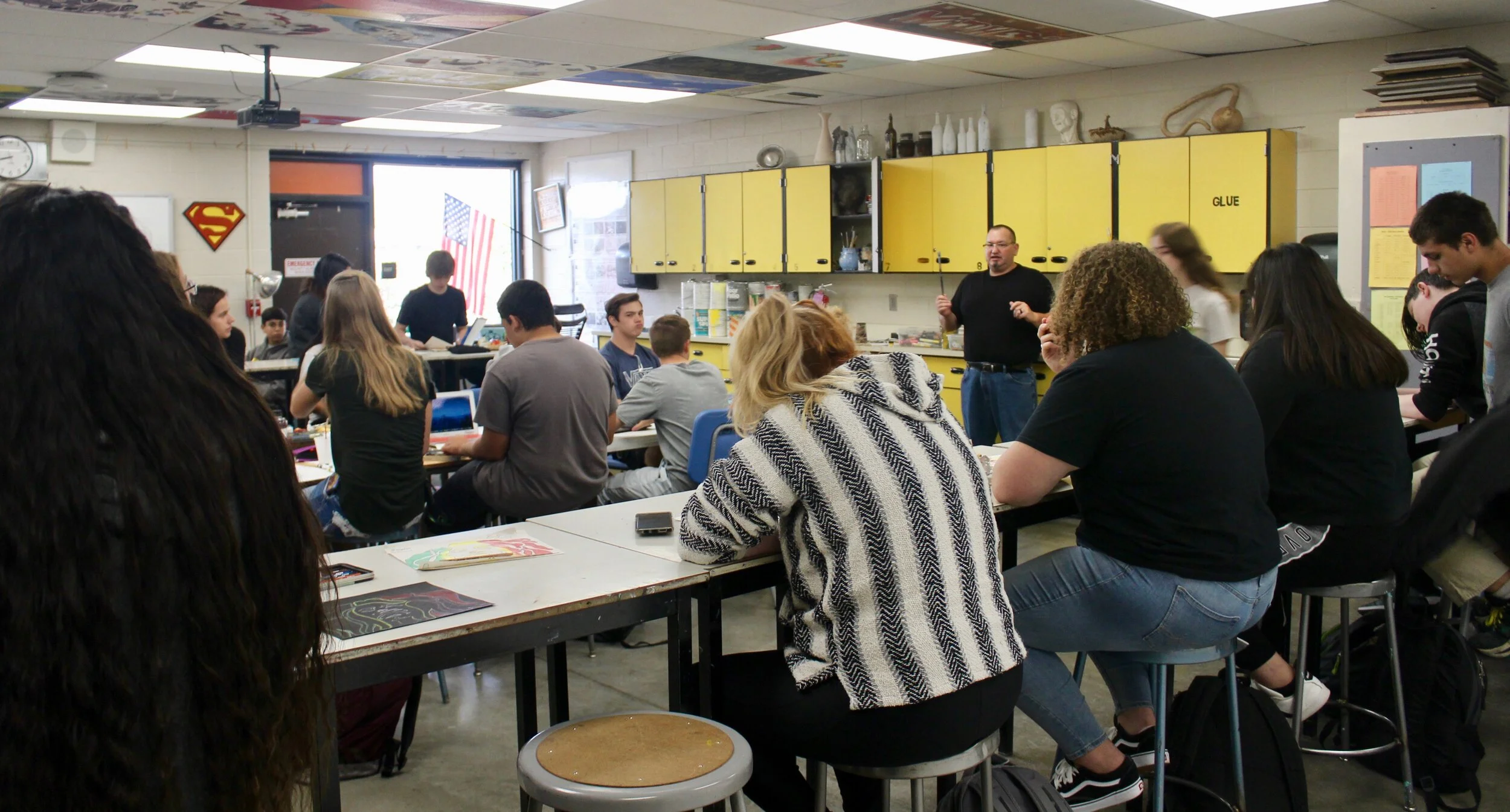 Mr. Scott Santisteven in Art going over upcoming project.