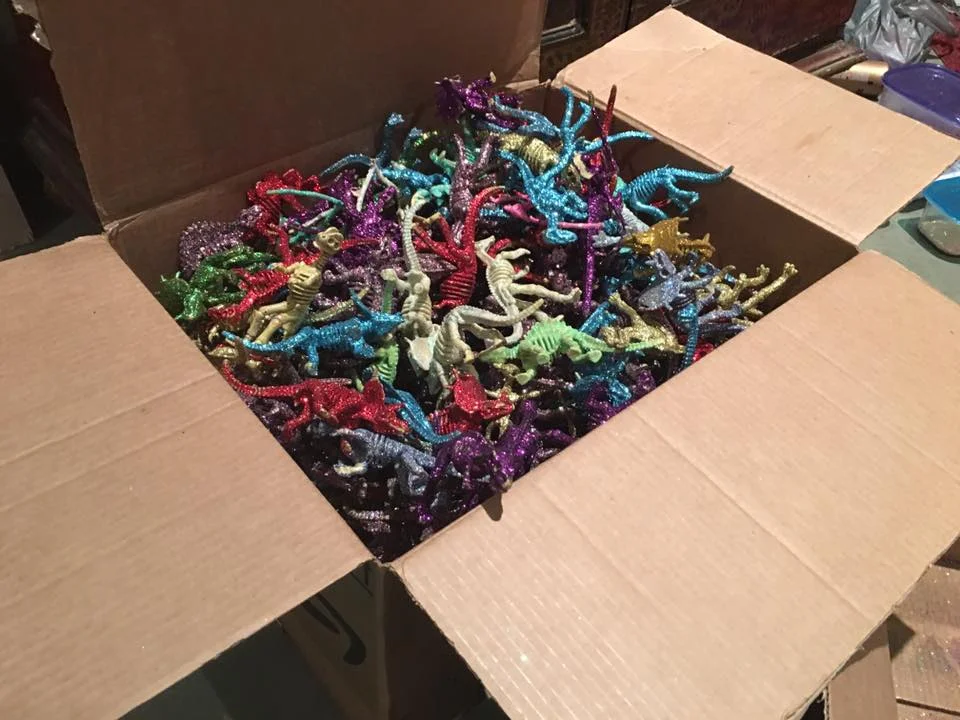 We had boxes and boxes of glittered up Dinosaur skeletons. It was quite a production to get over 1,300 of these made, from Krewe members all around the country.