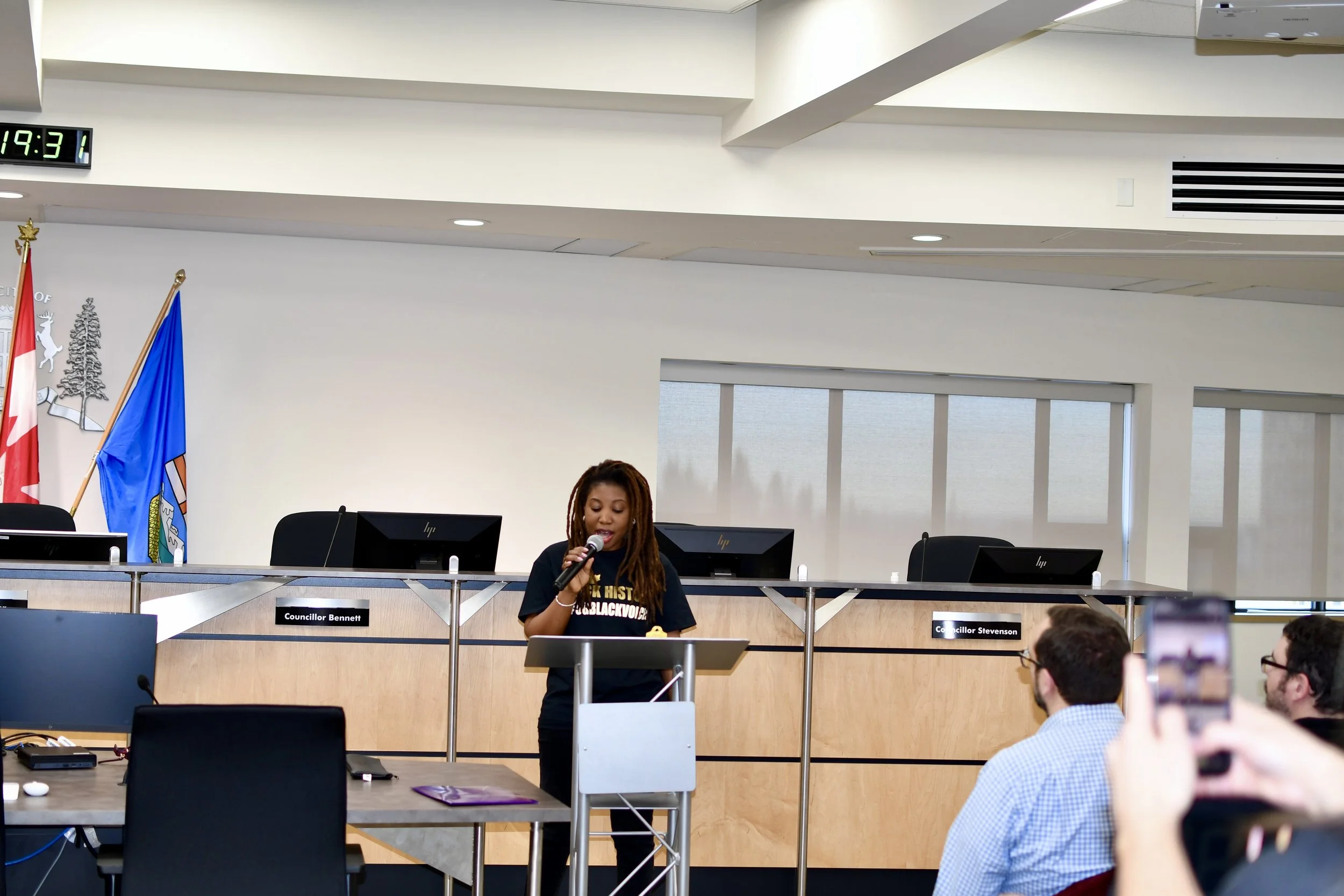  Francess Cowan, Vice President of B.L.A.C.K.S.-Parkland and President of Africentric Arts, reading her poem at Spruce Grove’s historic Black History Month proclamation ceremony. 