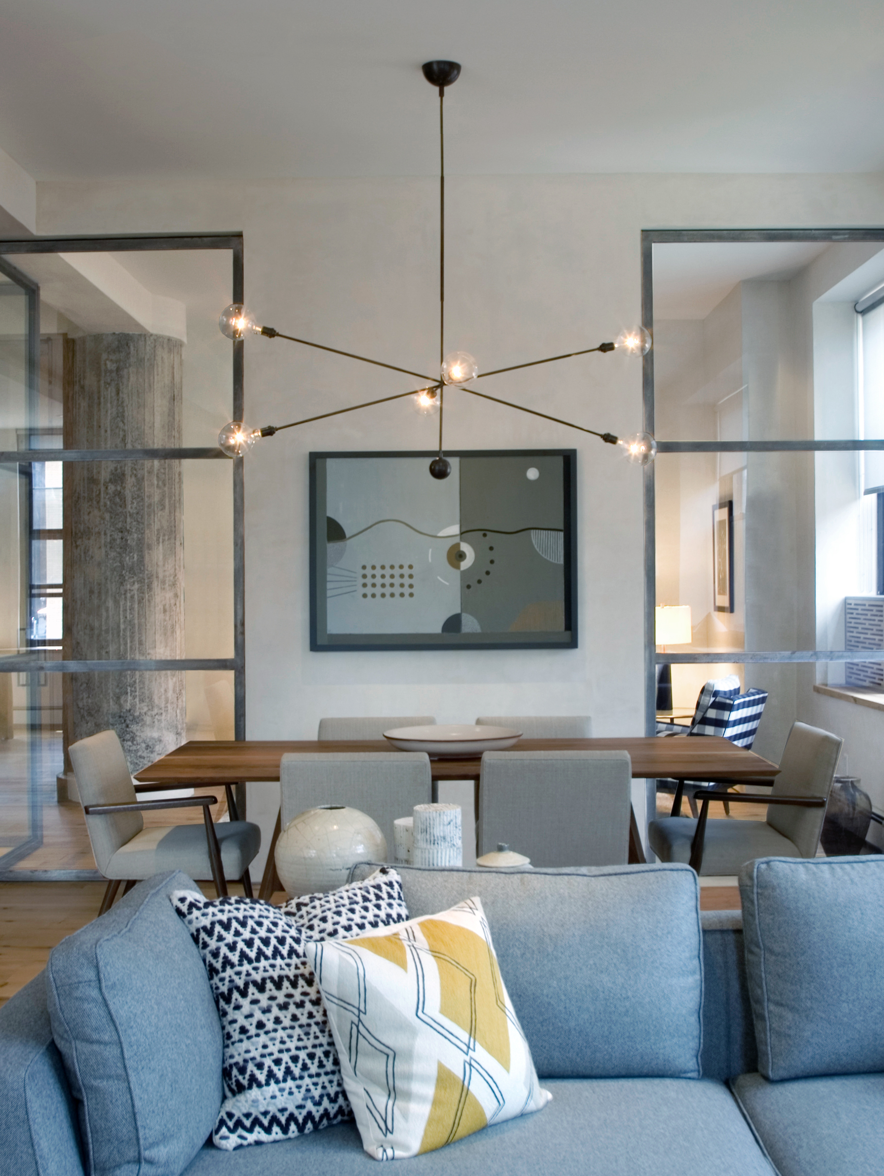 SoHo loft contemporary living room and dining room interior design by Jones Rowan Studio.