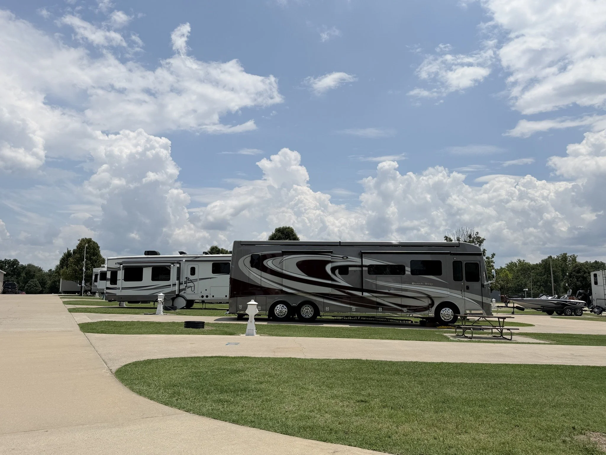 Spacious RV sites at Monkey Island Resort near Grand Lake, Oklahoma with concrete pads and landscaped grounds.