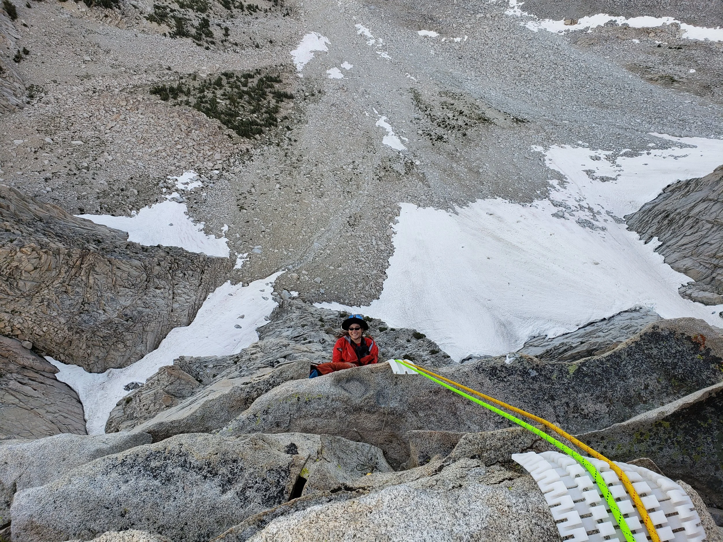 The litter attendant and subject nearing the summit. Image by B. Beck
