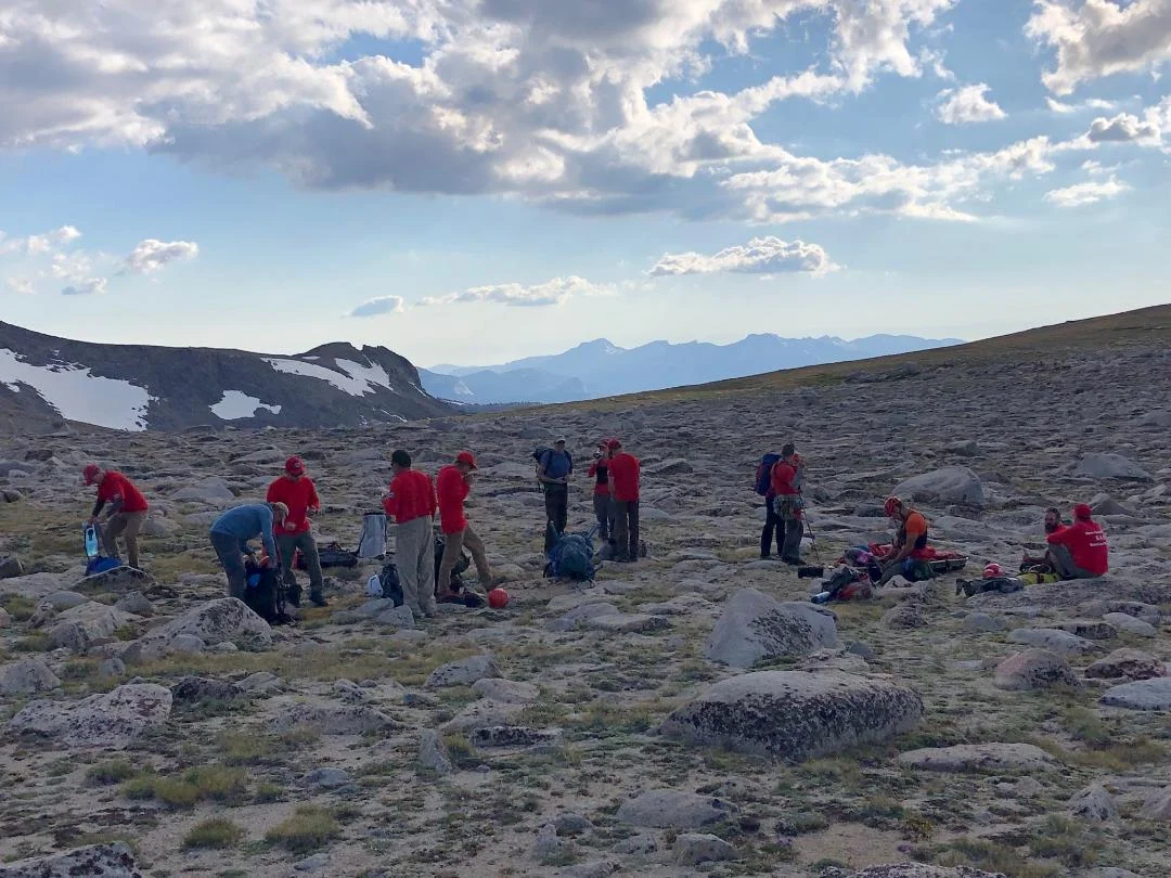 Helo extraction complete, packing up the gear for the hike out. Image by N. Endo