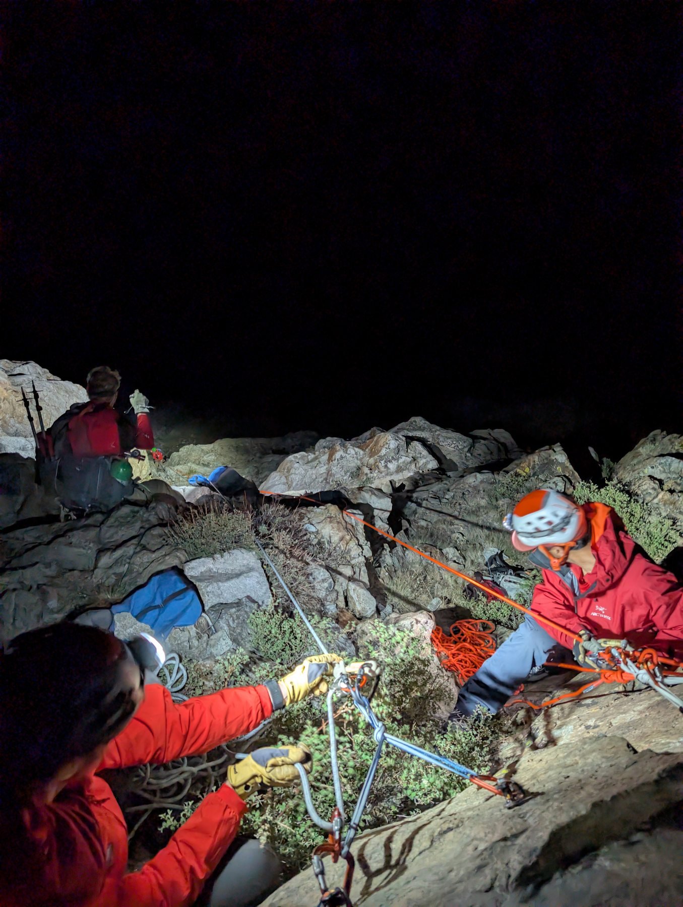 Mono SAR volunteers operating the rope system on rocky terrain at night