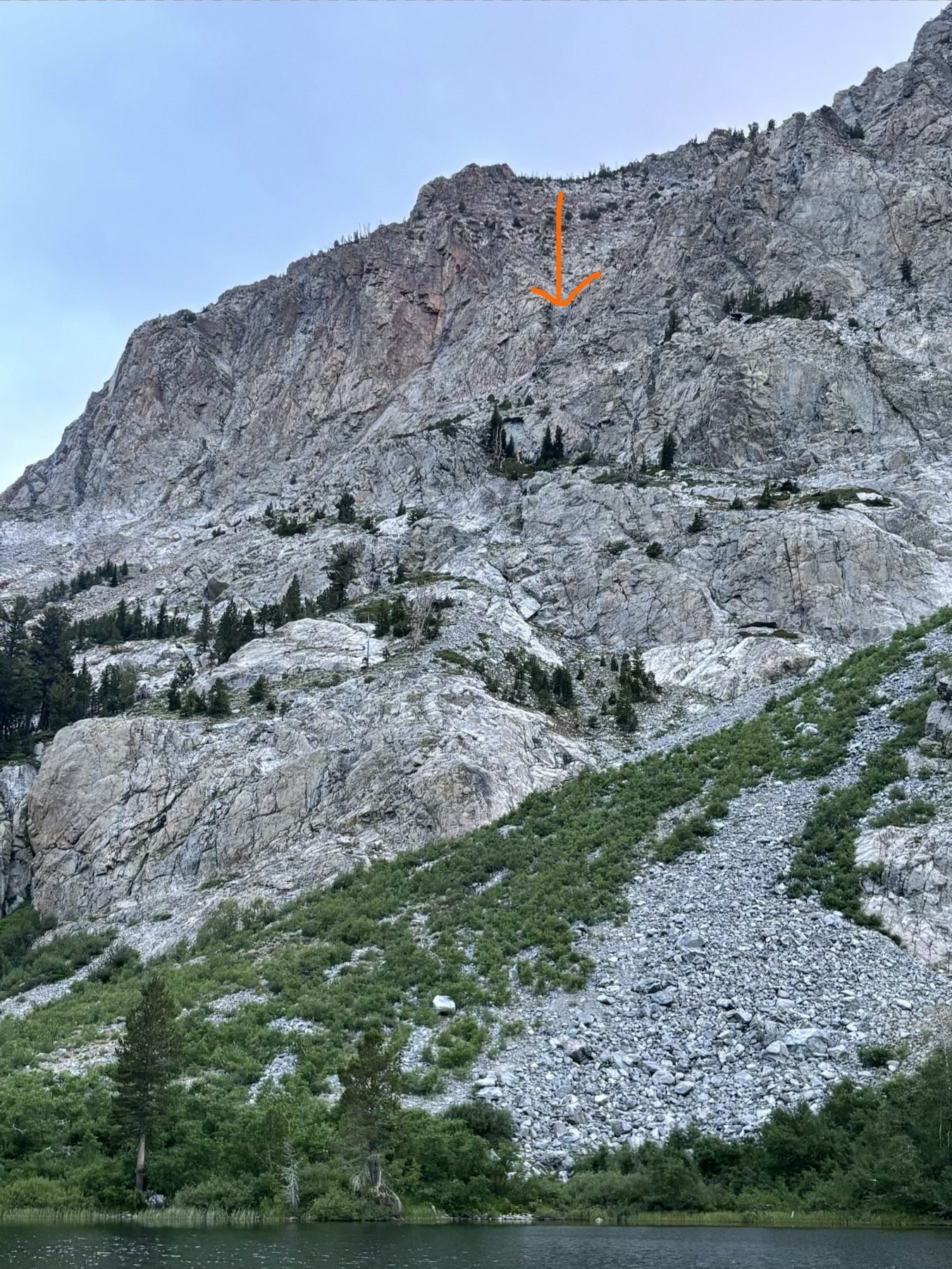 Cliffs above Fern Lake with an arrow marking the area where Scott was found