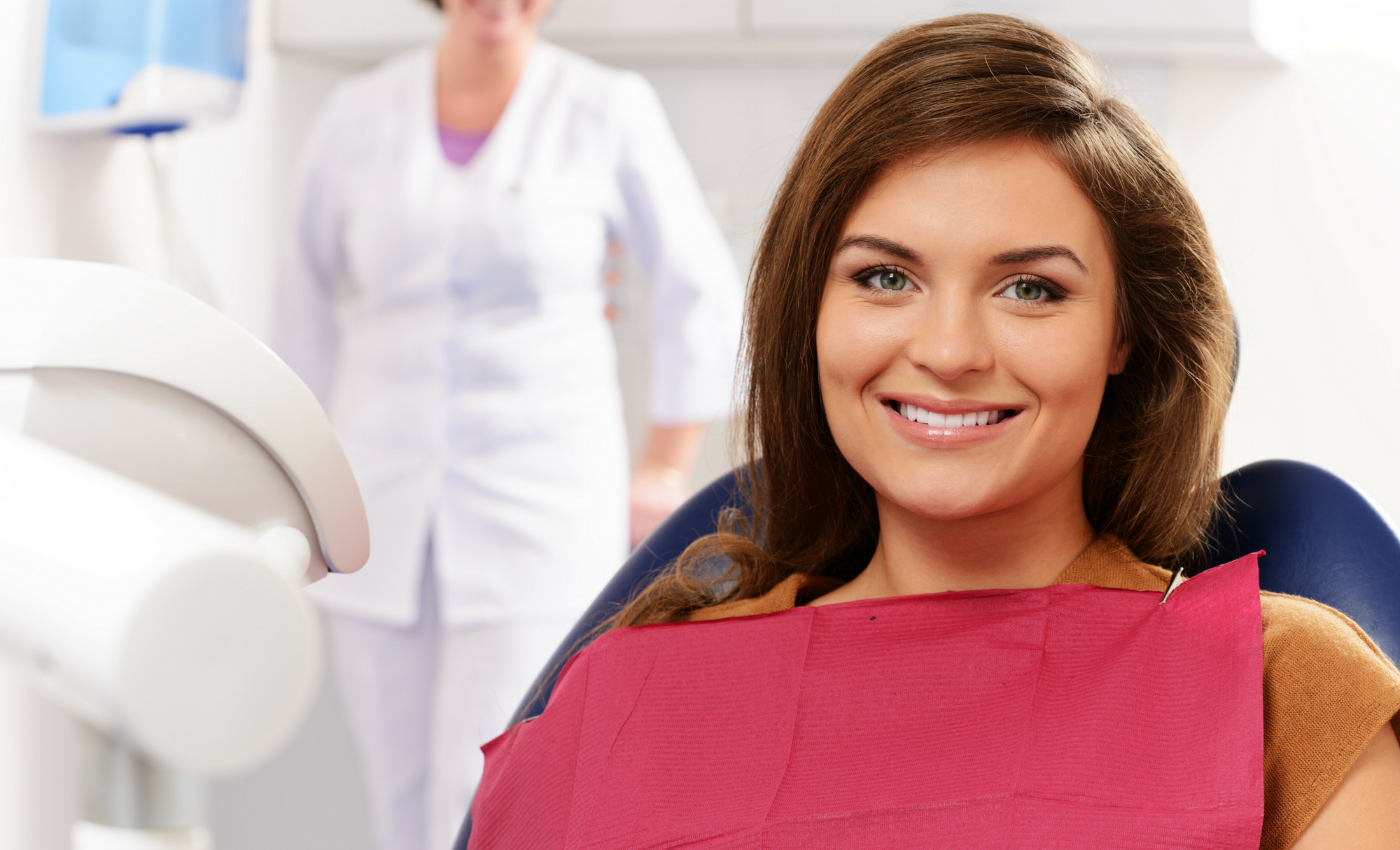 woman with health smile at dentist 2.png