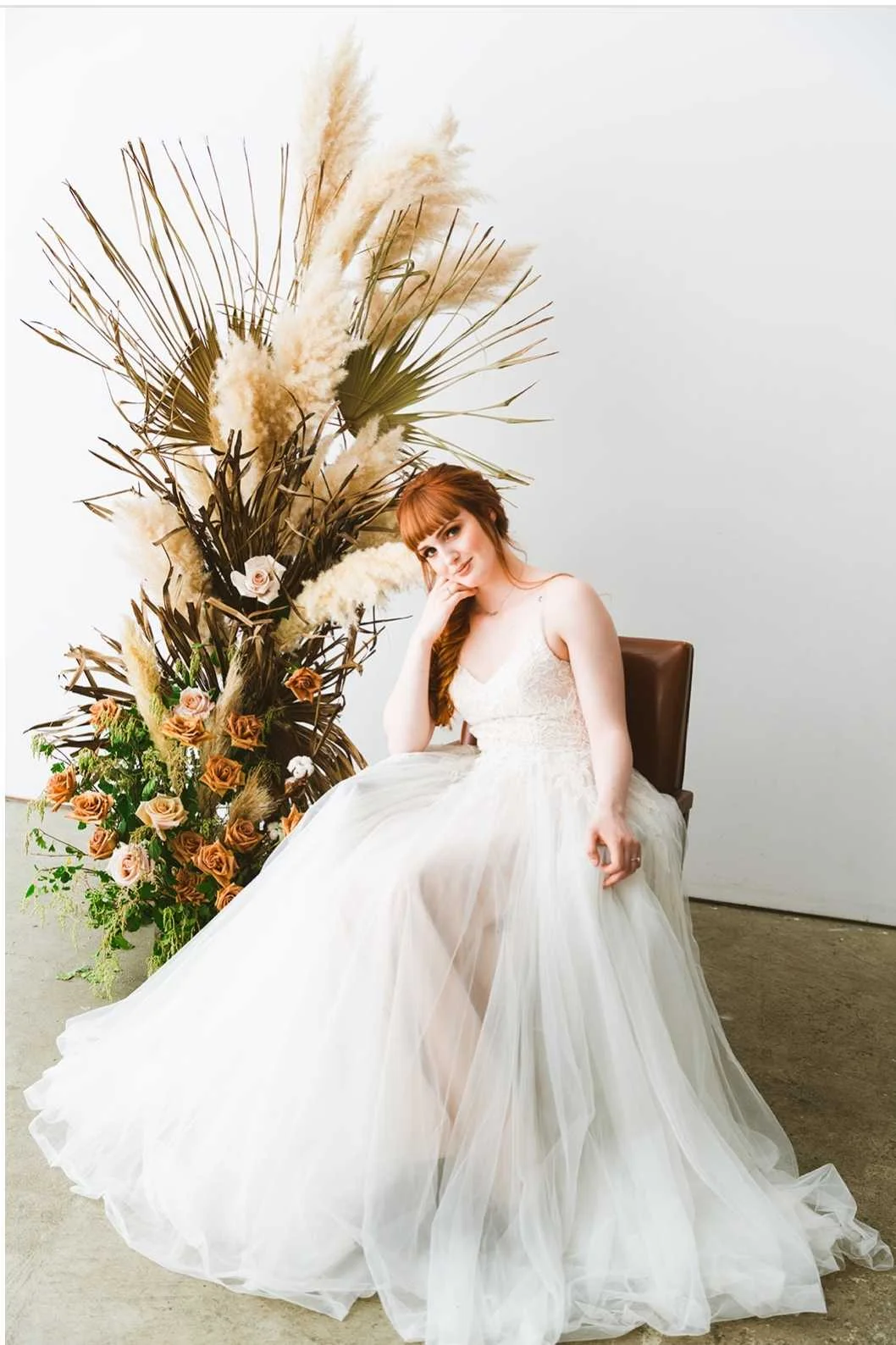 Taupe and blush roses in a minimalist floral installation rustic industrial natural light wedding venue Victoria, B.C