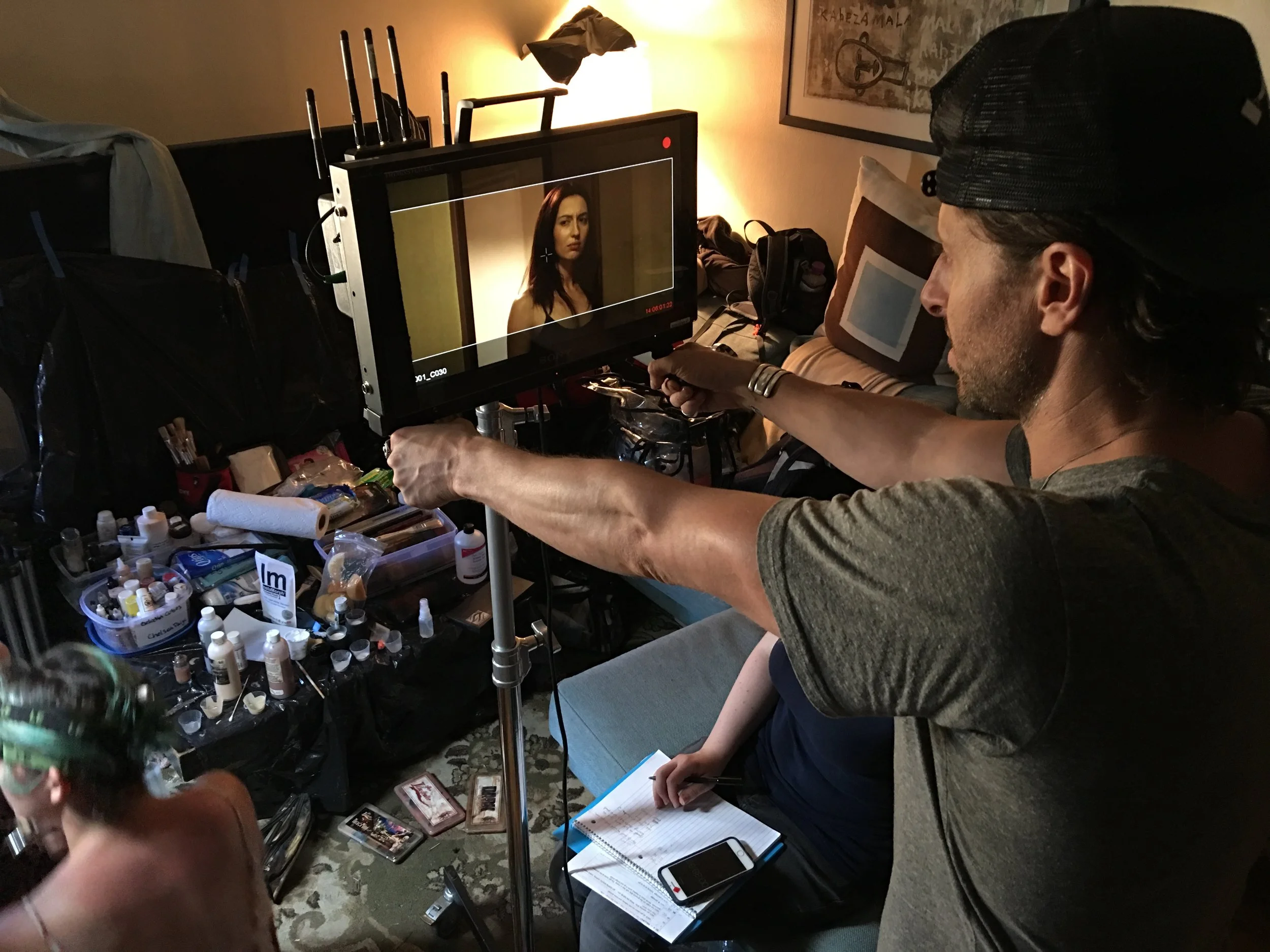 Director Nathan Crooker watches the arrival scene play out. 