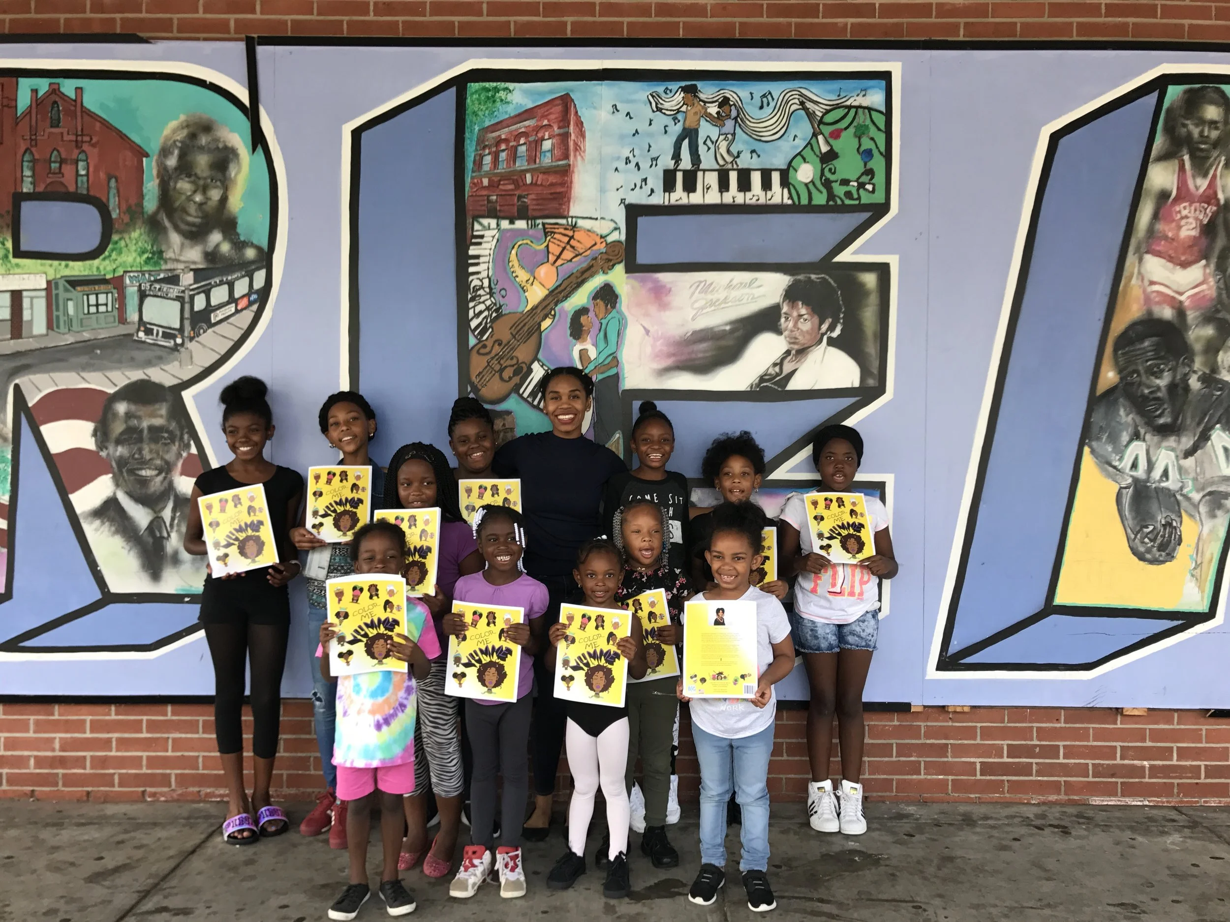 Founder &amp; CEO Taaj Marjanee outside of Stetson Branch Library in New Haven, Connecticut after the first "Brown &amp; Black Crayon Conversation” event.