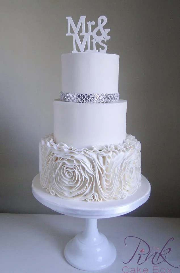 Rose ruffle wedding cake with sequin band
