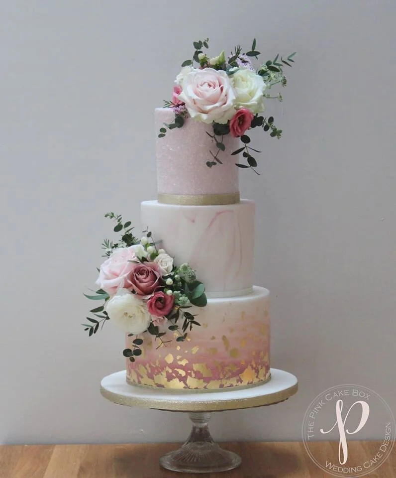 watercolour ombre wedding cake with gold leaf, sparkles and marble with fresh flowers.jpg