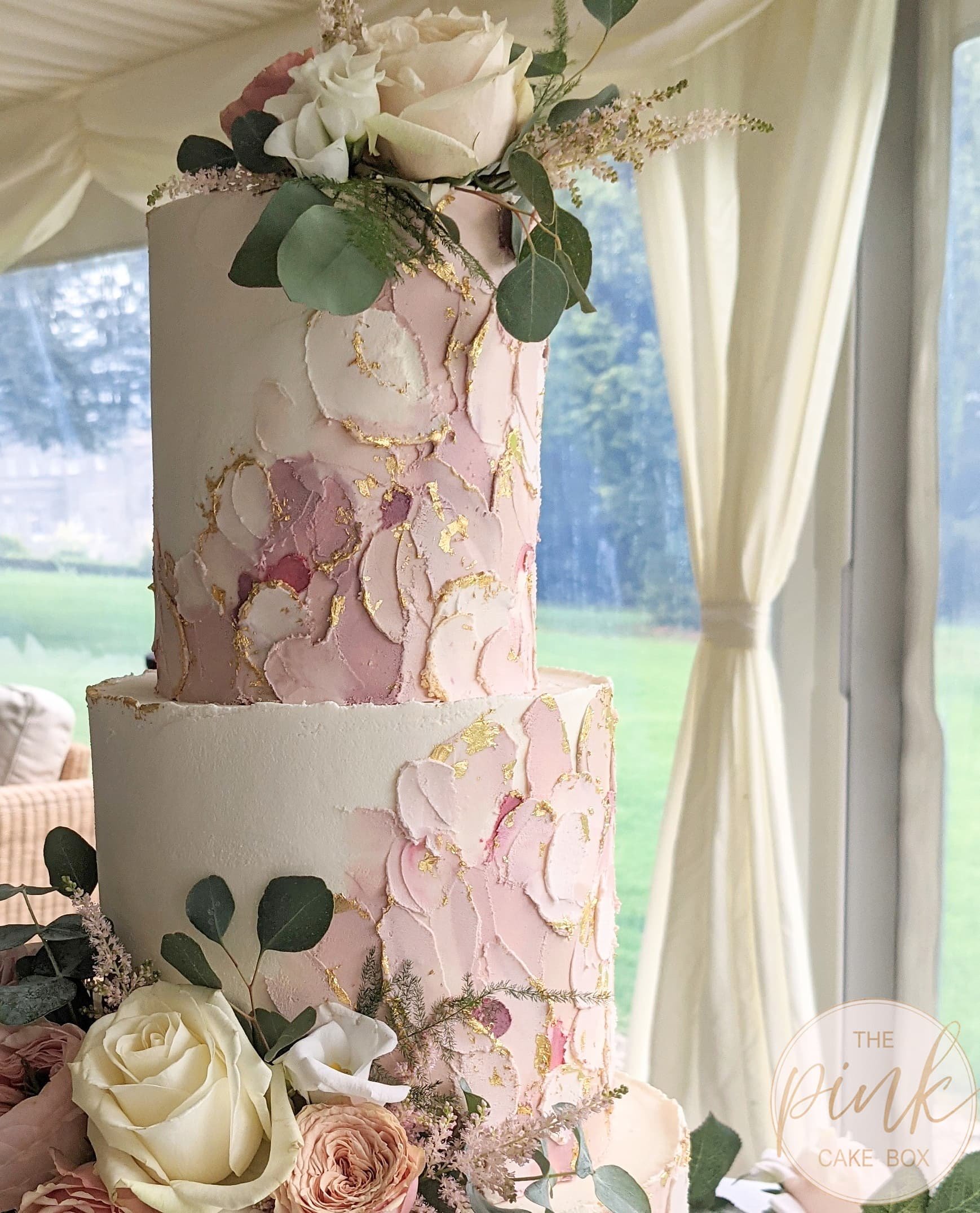 big wedding cake, decorated with buttercream flowers, on the grey stone  background Stock Photo - Alamy