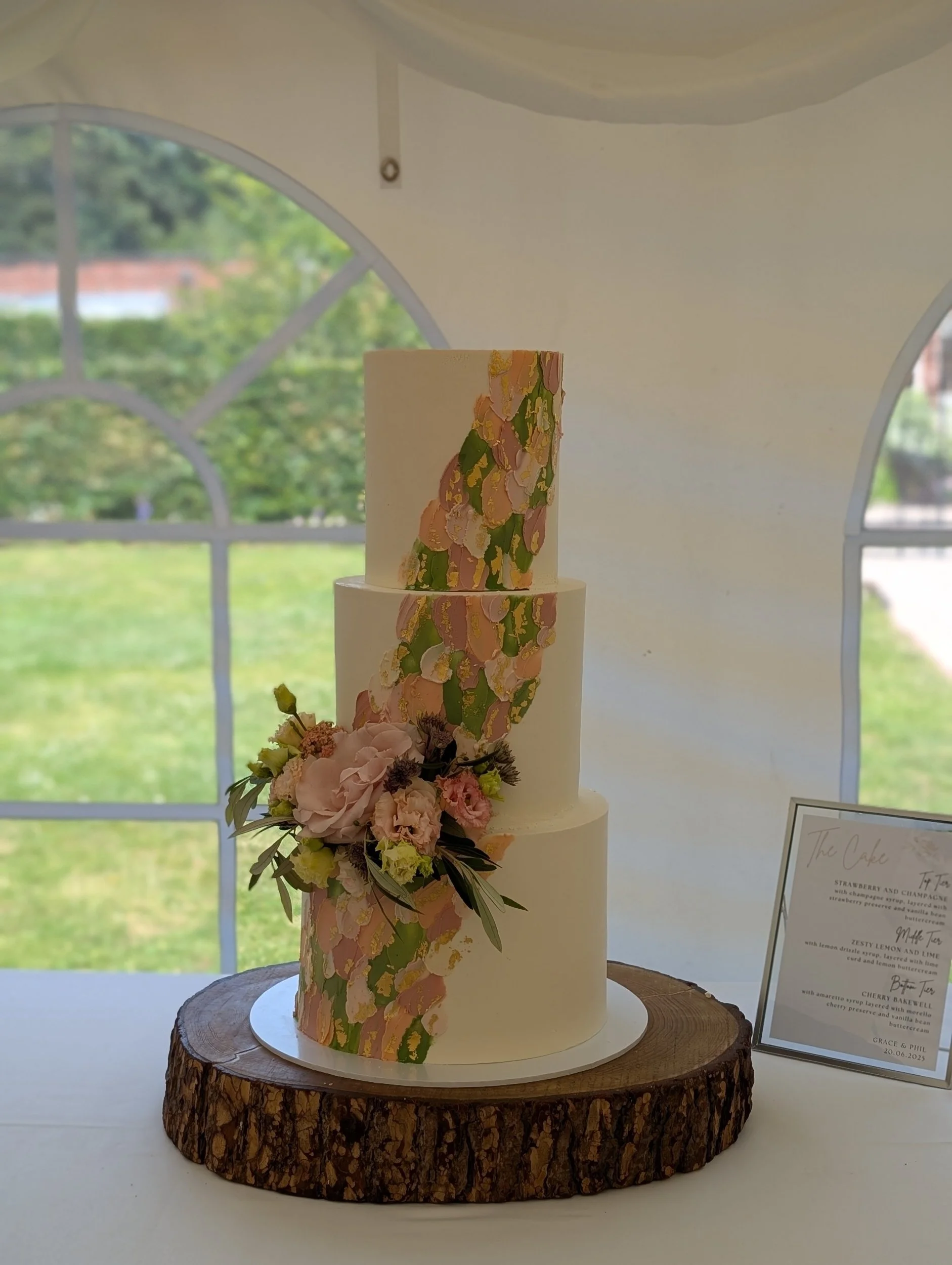 Textured buttercream wedding cake with gold leaf