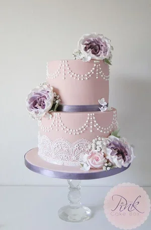 Dusky pink 2 tier wedding cake with sugar flowers