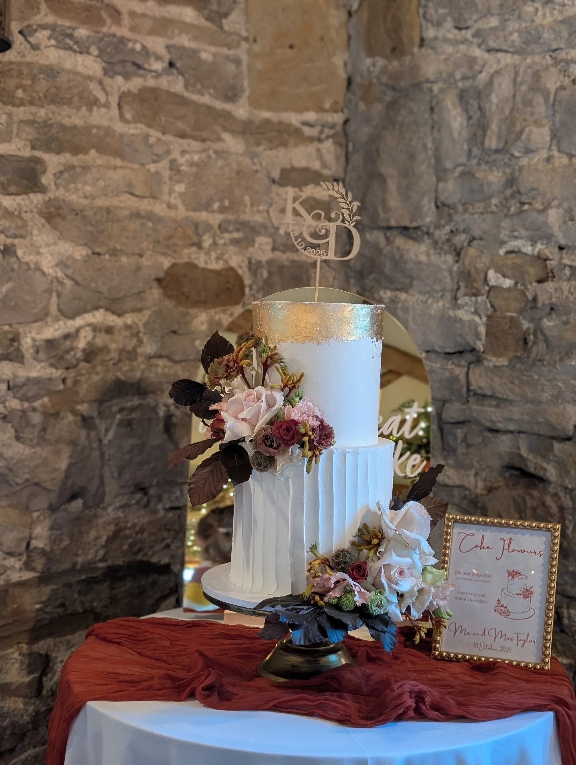 Buttercream wedding cake intimate wedding gold leaf