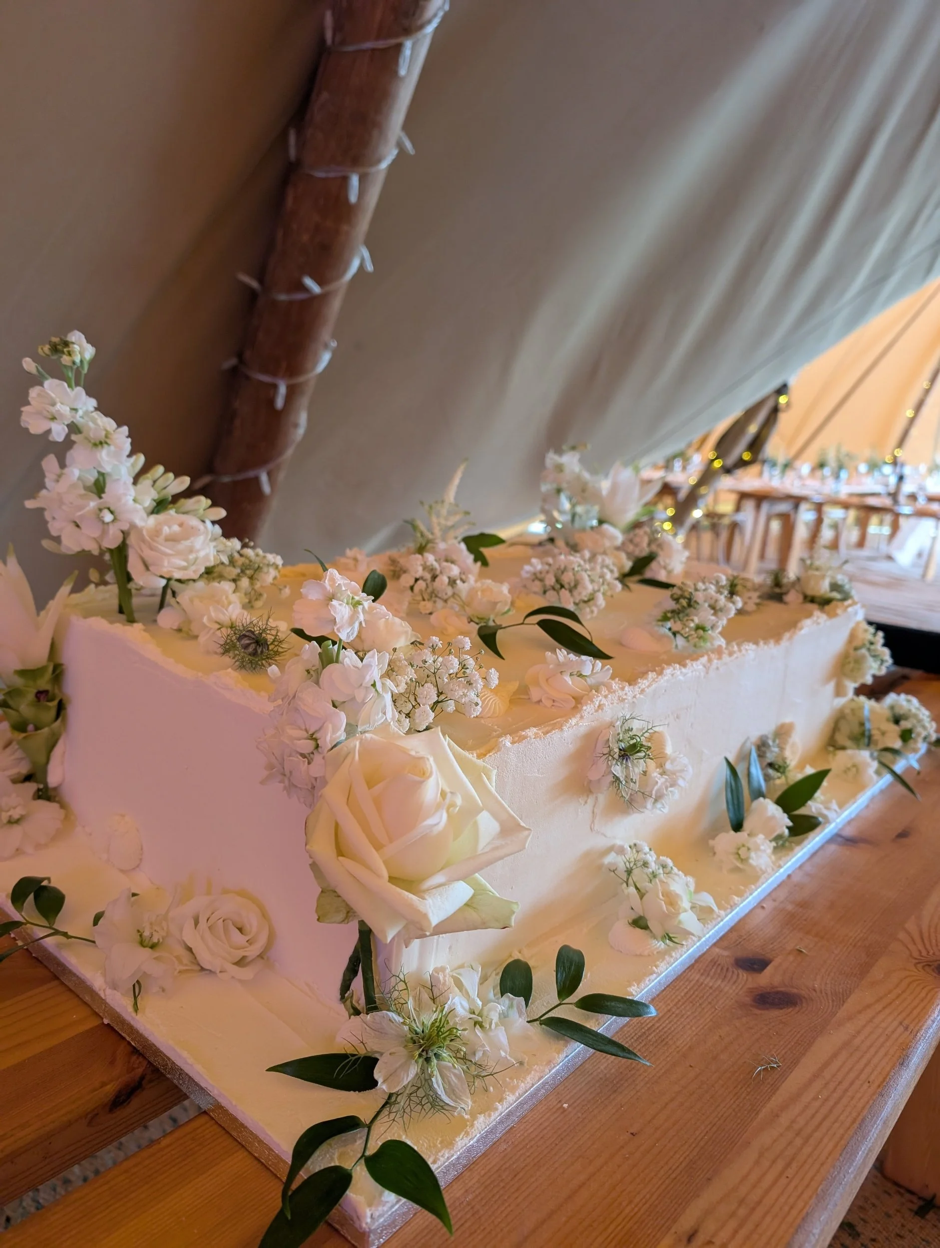 Slab wedding cake with fresh flowers