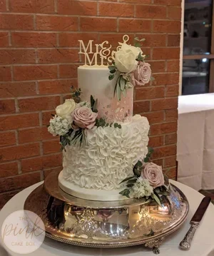 Elegant 2 tier wedding cake with sugar flowers