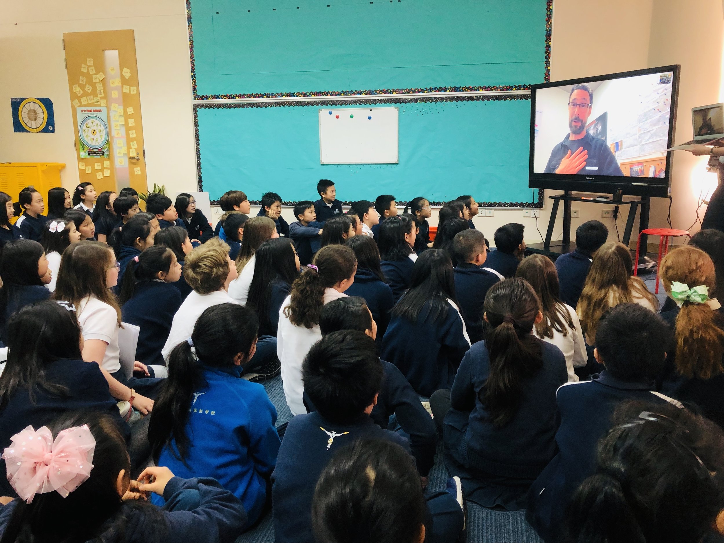 Out of the Blocks journalist Aaron Henkin Skypes in to Grade 4 to encourage students to find stories all around them.