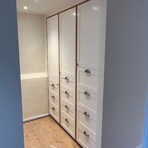 We supplied a bespoke floor-to-ceiling his and her wardrobe to optimise the space in our customer's home. Made out of durable birch plywood internally and a poplar MDF sprayed with a white satin finish.