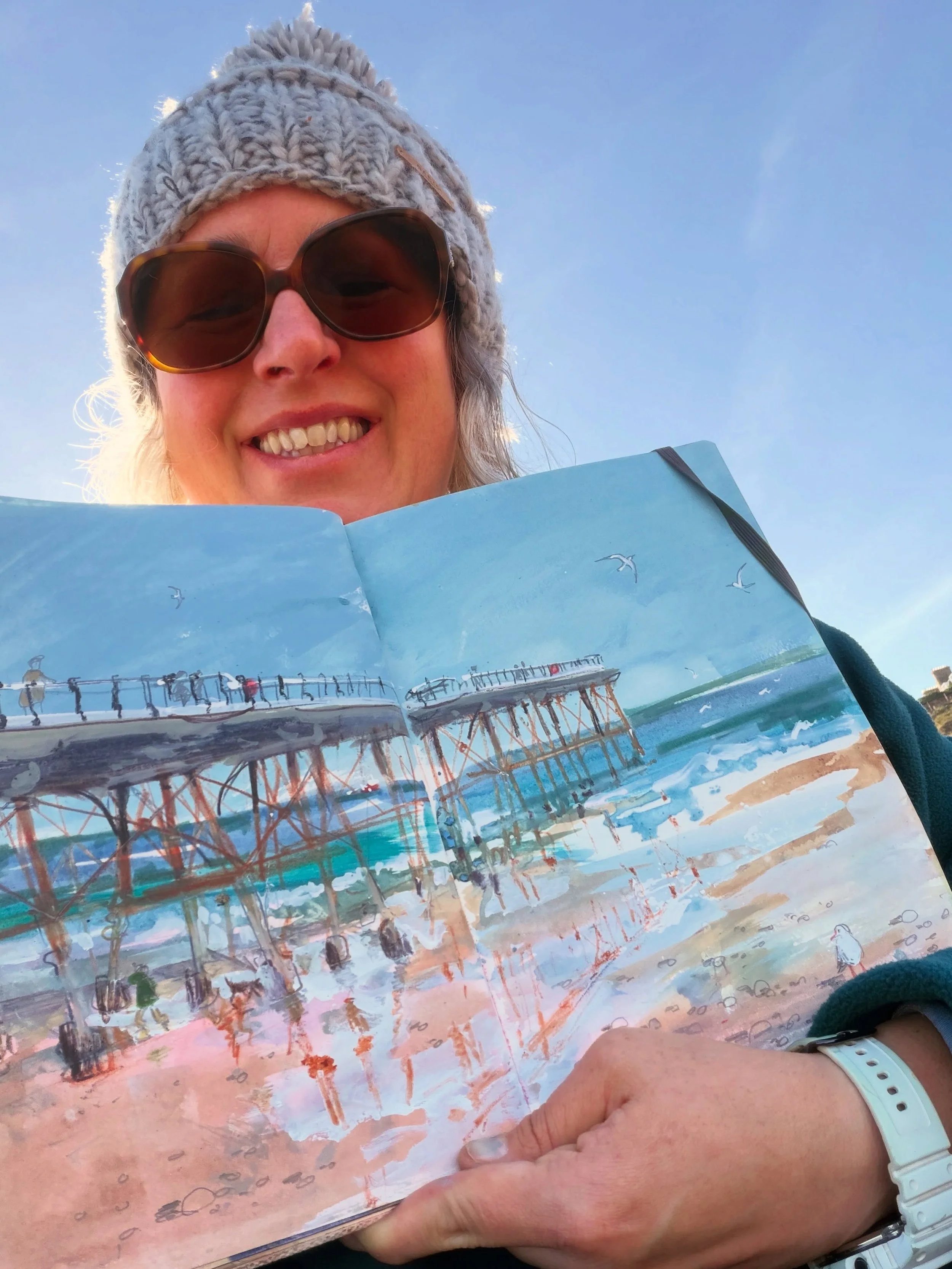 Day 4427: Day out of the studio drawing at Saltburn by the Sea. Ticking a pier off my list for my 2026 #jennydrawswater 💧 observational drawing project. A wind farm at sea too.

Painted using gouache, household wall paint tester pot, inktense pencil