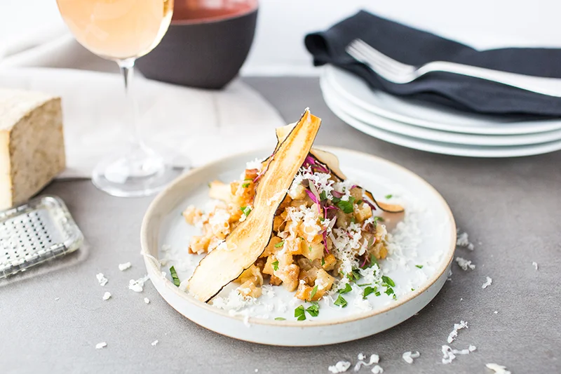 Lunch dish with parmesan shavings and wine