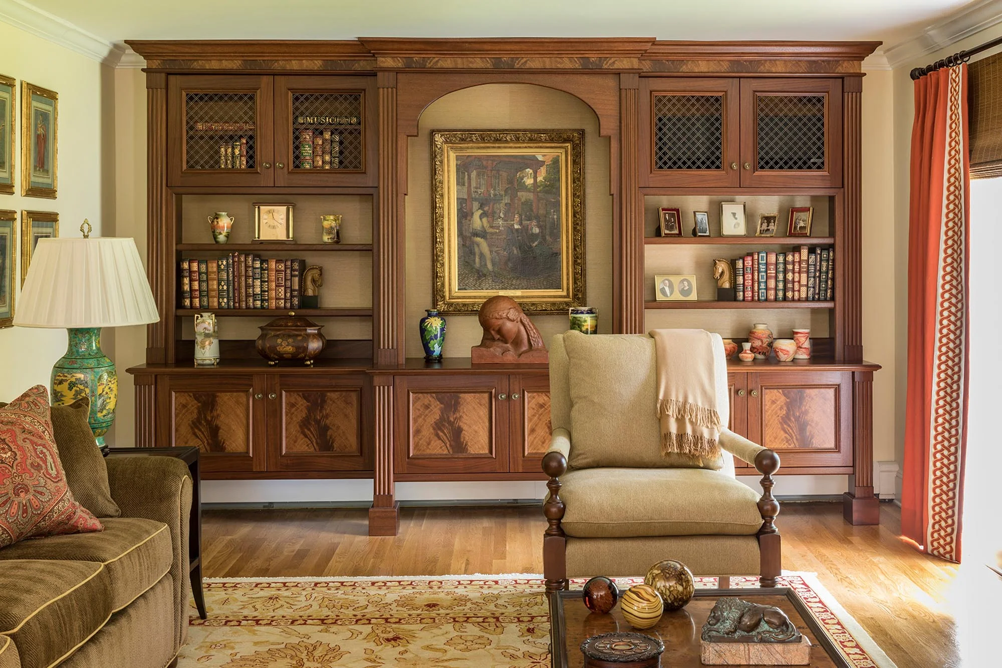 Spacious wooden cabinet with displays and chair