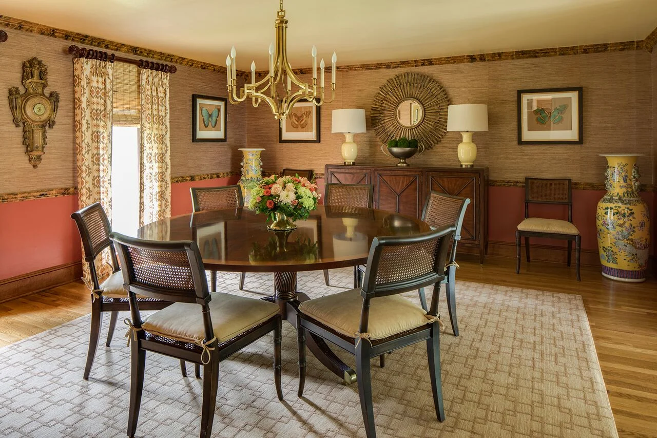 Stylish dining area with six-sitter table and printed curtain