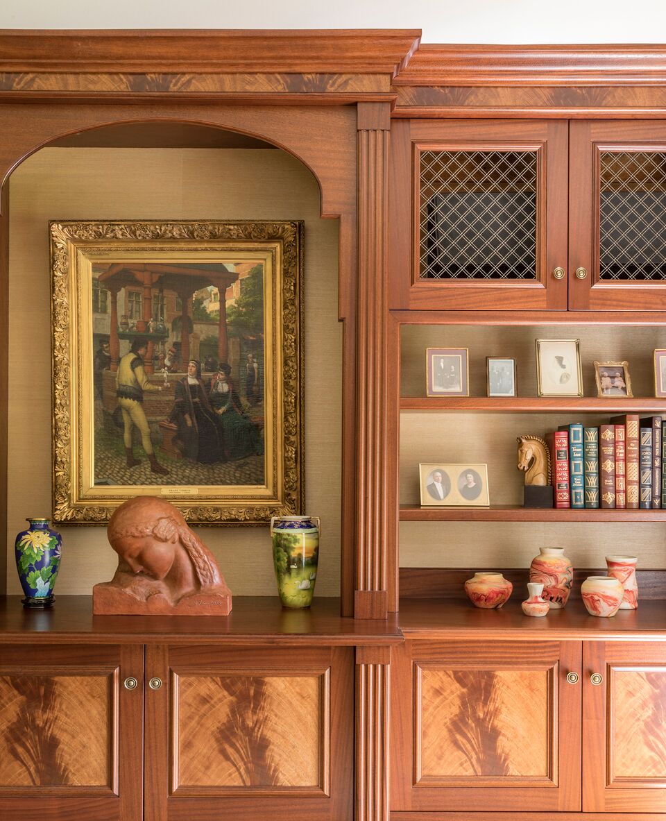 Wooden cabinet with painting and books