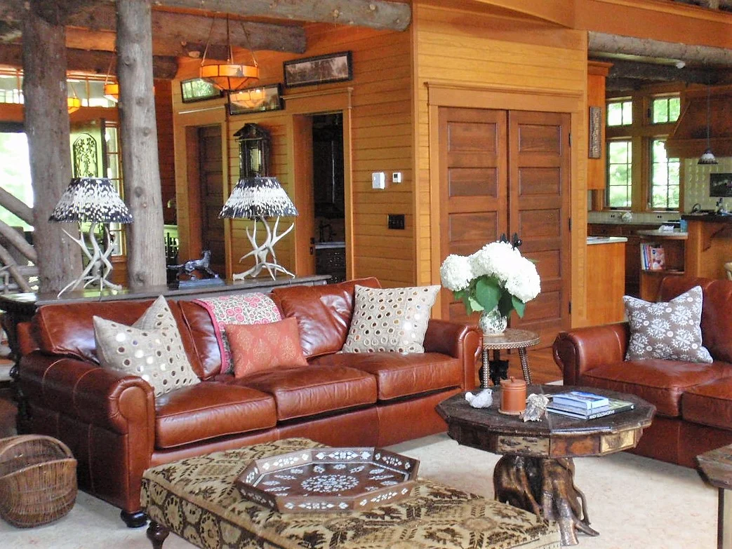 Wooden style living room with leather sofa and stylish center table
