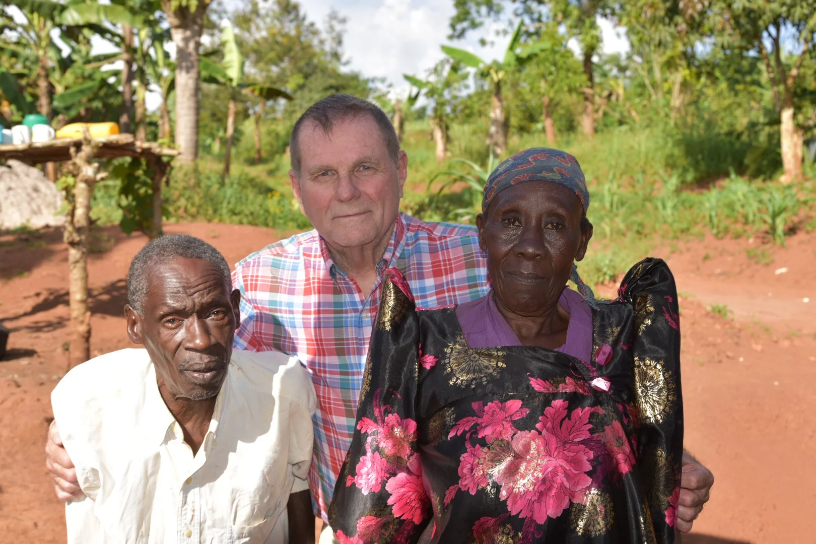 Pastor Steve with the parents of the teacher