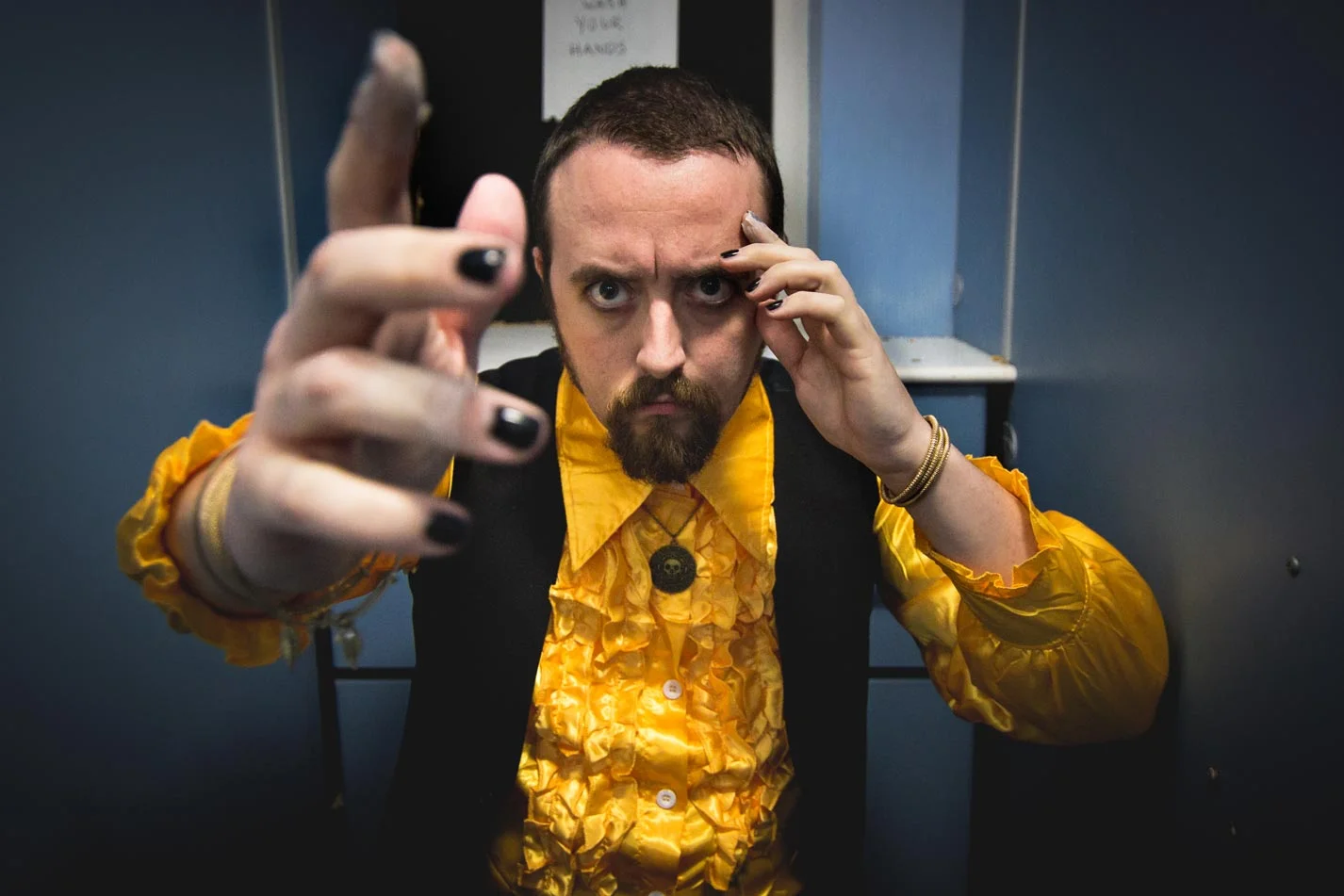 Liam Angus as The Medium in Backstage