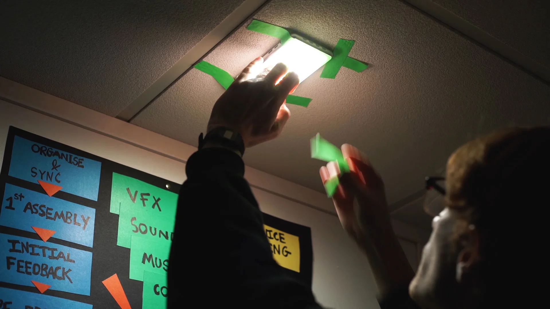 Hanging from a ceiling as a hair light or top light. It only weighs 525g so you CAN hold it up with some tape!