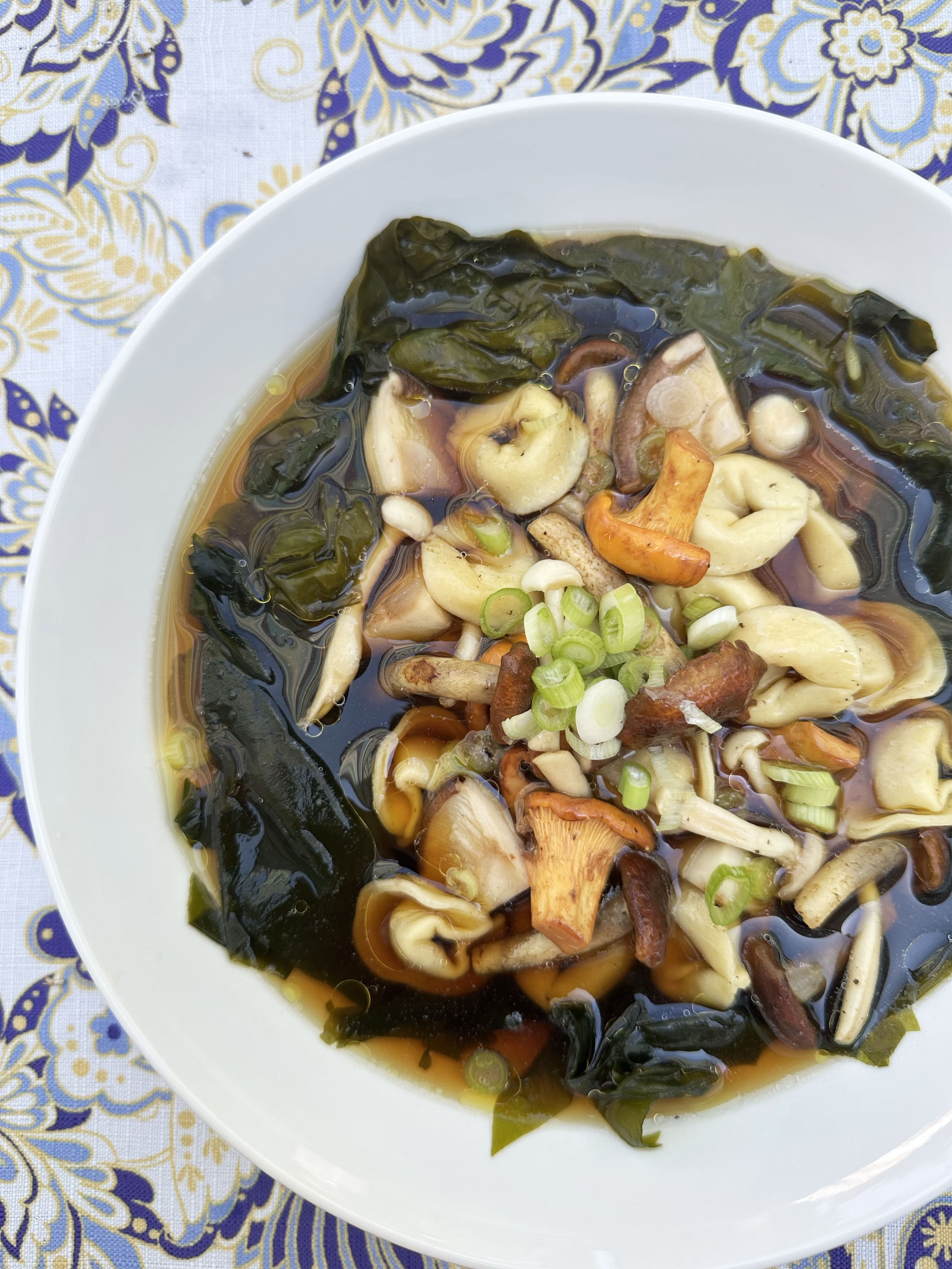 Smoked Dashi with Black Garlic Molasses, Kombu, Wakame, Wild Mushrooms &amp; Tortellini