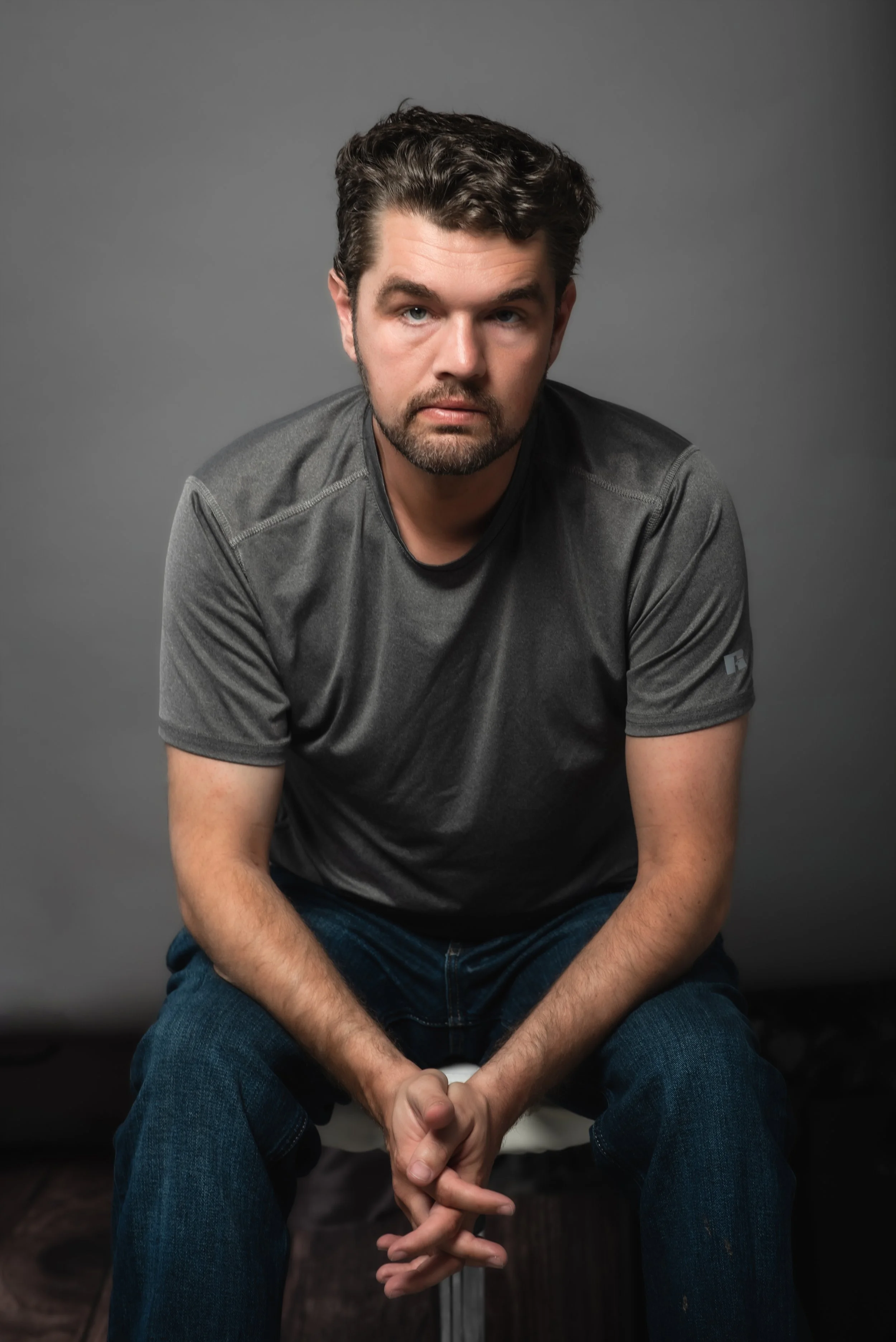  In studio headshot of a male executive against a gray backdrop in Vancouver, Washington. 