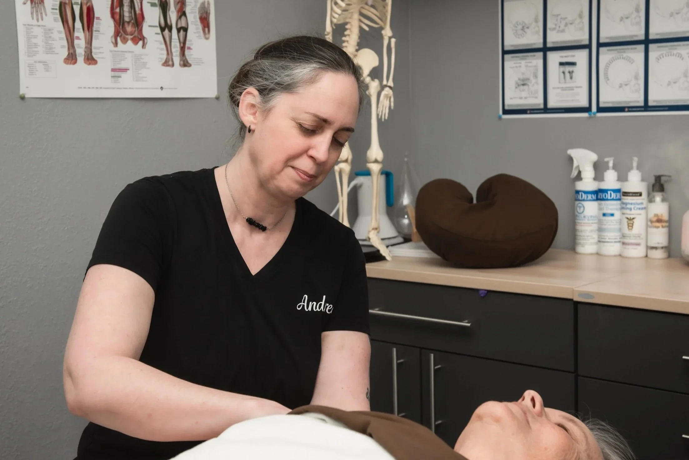 Business branding photograph of a medical massage therapist treating a patient.