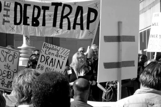 Protesters fighting against unfair housing debt . 