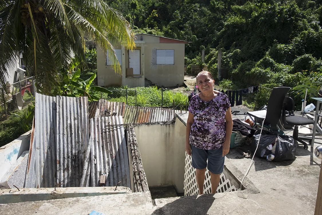 This woman's home was very heavily damaged by Maria.