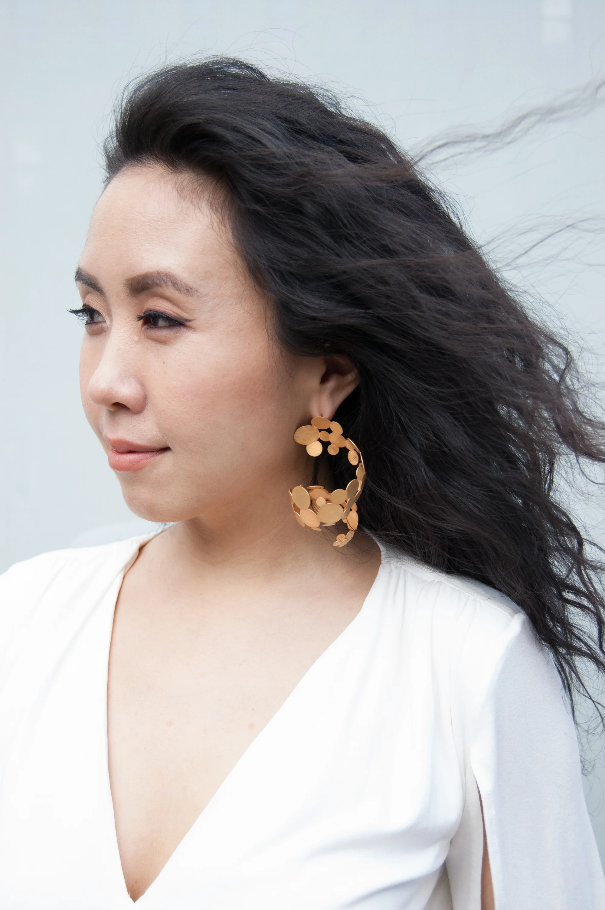 Designer Youngeun Han in her Cascading Gold earrings. Photo by: Jeemin Kim.