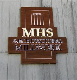 Sandblasted cedar sign with carved elements