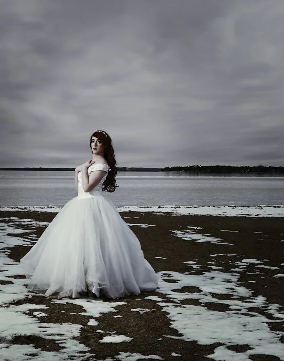  Sam Lauzon in a wedding dress on the beach durring winter season. 
