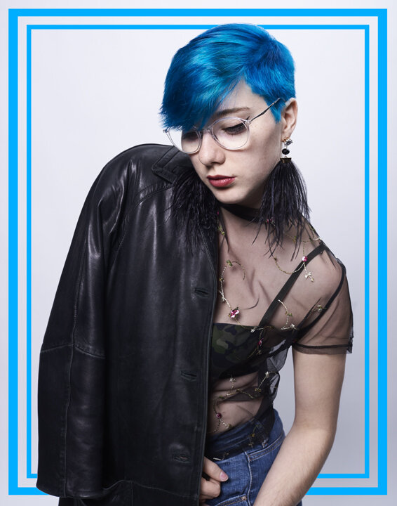  Self Portrait of Christine Lauzon wearing a mesh shirt and a leather jacket. 