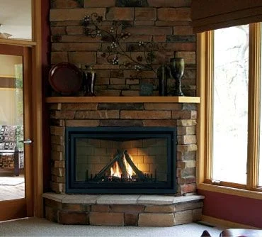 Living area fireplace stone surround white carpet.jpg
