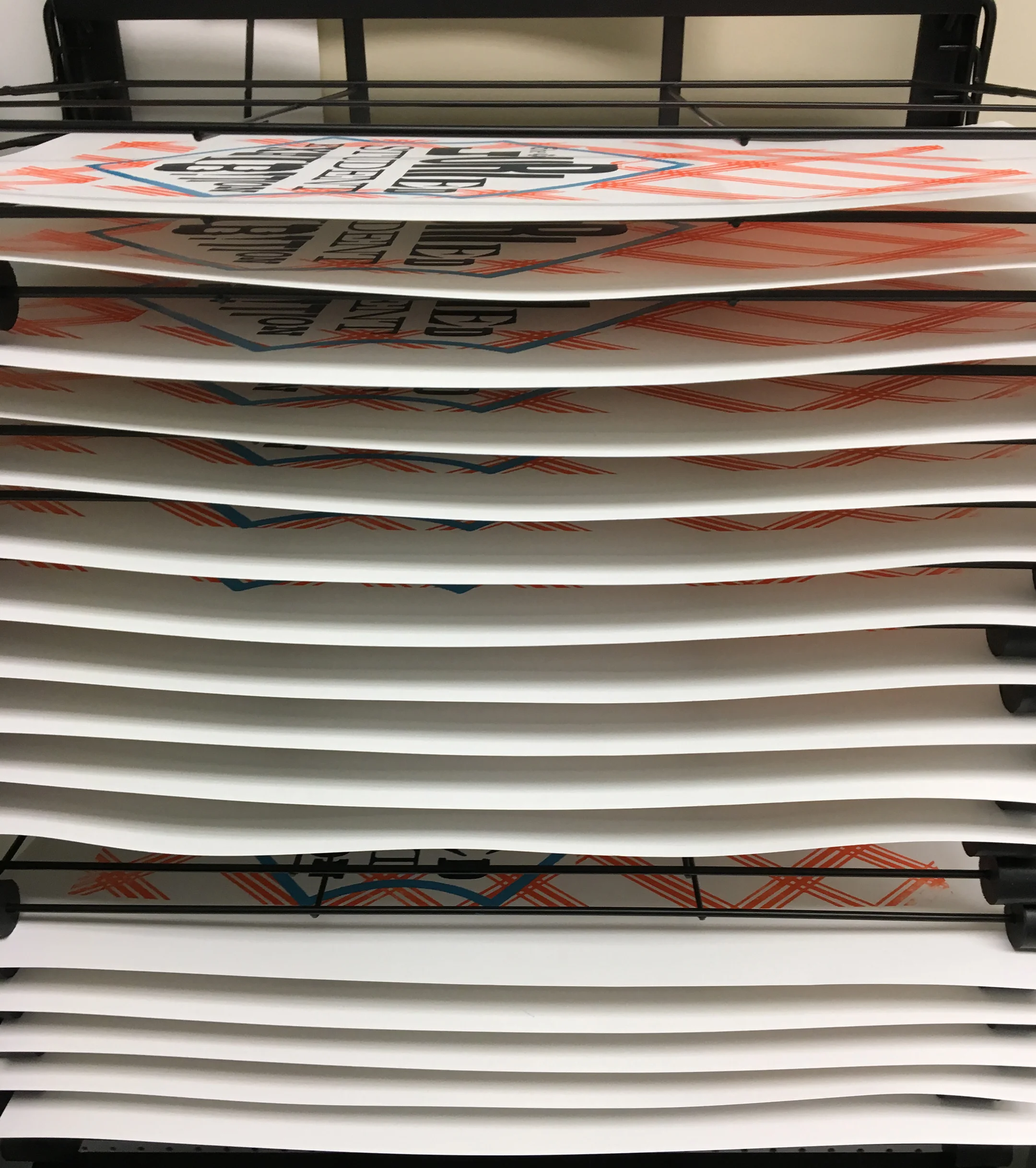 posters_on_drying_rack.jpg